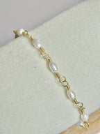 Close up shot of Gold Classic Pearl and Mother of Pearl Bracelet on display