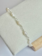Close up of the Silver Classic Pearl and Mother of Pearl Bracelet on display.