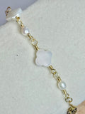Close up of the Gold Clover Pearl and Mother of Pearl Bracelet on display.