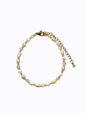 Pearl, pink beads, and gold bracelet on a white background