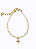 Premium Gold Pearl bracelet and star charm on a beige background