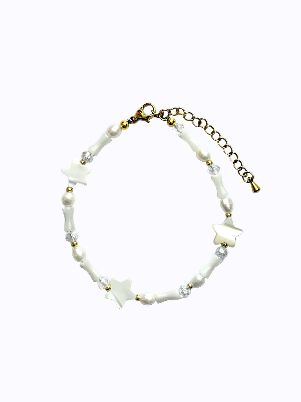 Gold Bracelet with star-shaped and cone-shaped pearls, round pearls and clear beads, on a white background.